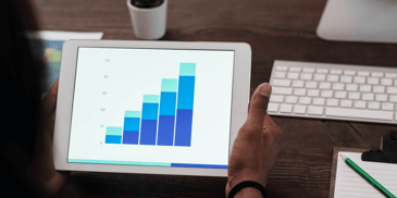 Graphs on a tablet with increasing bars