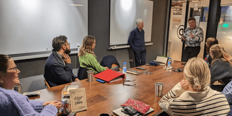 Baxendale colleagues sitting in a meeting room together